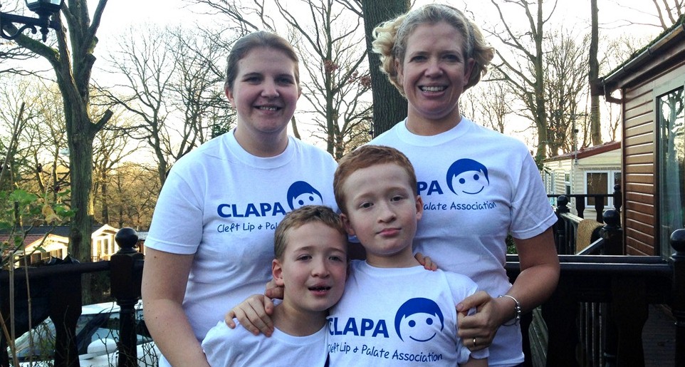 A family wearing CLAPA t - shirts