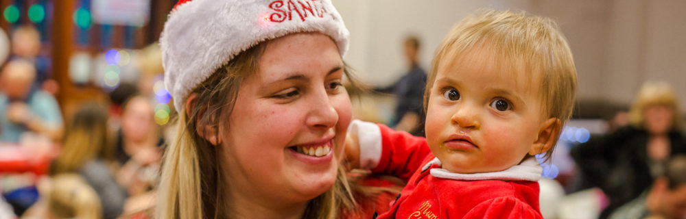 A mum and daughter at a CLAPA Christmas Party