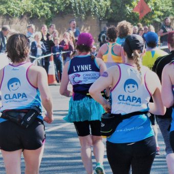 Four runners in CLAPA vests