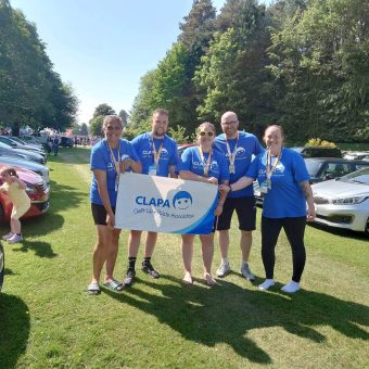 Group photo of the Kitlwalk with a CLAPA flag