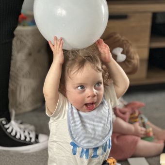 Theo holding a balloon
