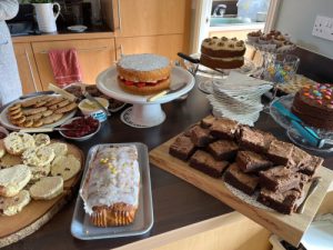 Bake sale display with cakes and scones